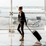 Young Woman Boarding Plane Smiling