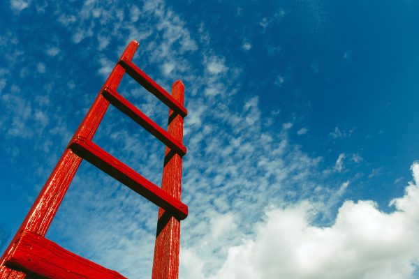 Red Staircase Rests Against Blue Sky. Development Motivation Busines Career Growth Concept