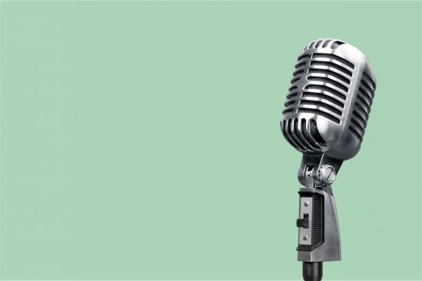 Retro style microphone on background