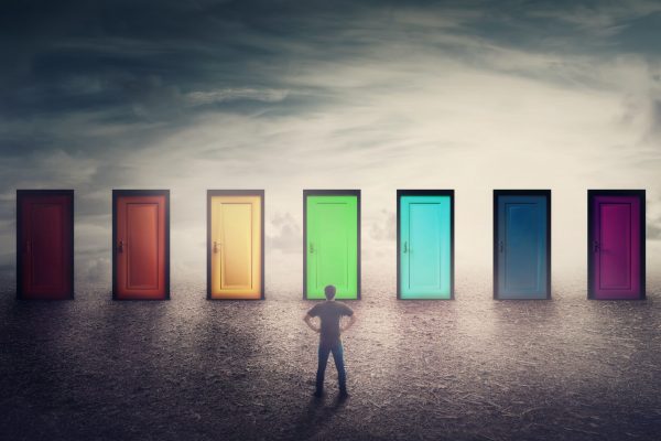 Confident guy in front of many doors different colored has to choose one. Difficult decision, important choice concept, failure or success. Ways to unknown future, career development opportunity.