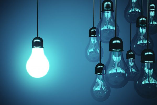 lamps hanging the wire and one glows. Business idea concept. 3d rendering