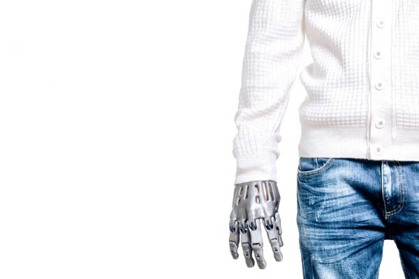 Man with a prosthetic arm on an isolated background.